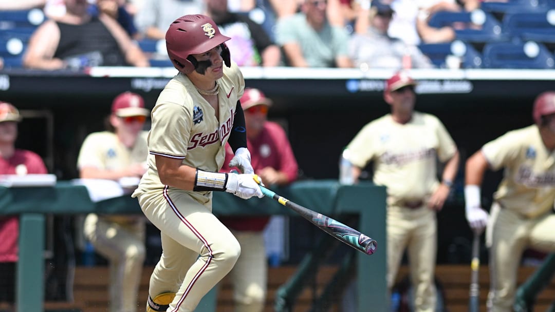Jun 16, 2024; Omaha, NE, USA;  Florida State Seminoles designated hitter Marco Dinges (43) singles in a run against the Virginia Cavaliers during the fifth inning at Charles Schwab Field Omaha. Mandatory Credit: Steven Branscombe-Imagn Images