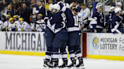 The Penn State Nittany Lions celebrate a goal against Michigan in a Big Ten Tournament game at Yost Ice Arena.