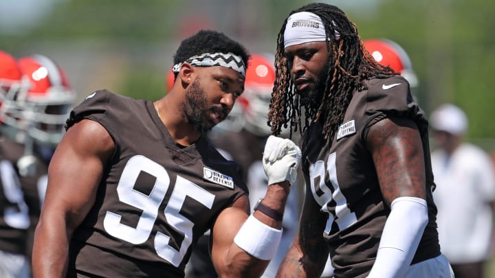 Browns defensive end Myles Garrett, left, works with defensive end Alex Wright during minicamp, Wednesday, June 12, 2024, in Berea.