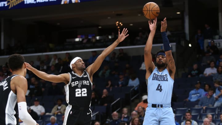 Apr 9, 2024; Memphis, Tennessee, USA; Memphis Grizzlies guard Jordan Goodwin (4) shoots as San Antonio Spurs guard Malaki Branham (22) defends during the first half at FedExForum. Mandatory Credit: Petre Thomas-USA TODAY Sports