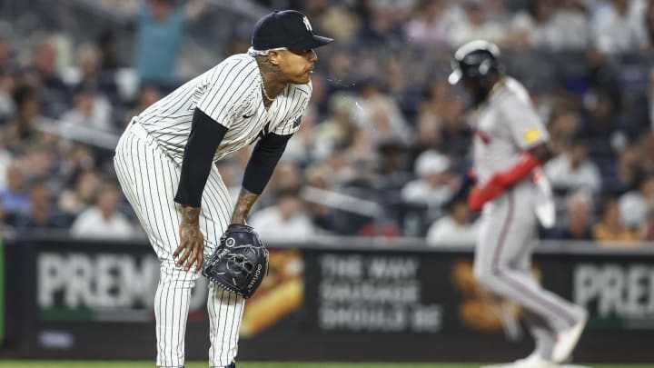 Jun 22, 2024; Bronx, New York, USA;  New York Yankees starting pitcher Marcus Stroman (0) reacts after giving up a home run against the Atlanta Braves in the seventh inning at Yankee Stadium. Mandatory Credit: Wendell Cruz-USA TODAY Sports
