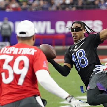 Feb 5, 2023; Paradise, Nevada, USA; NFC wide receiver Justin Jefferson of the Minnesota Vikings (18) runs the ball against AFC cornerback Pat Surtain II of the Denver Broncos (2) and right safety Jamal Agnew of the Jacksonville Jaguars (39) during game three of the 2023 Pro Bowl at Allegiant Stadium.
