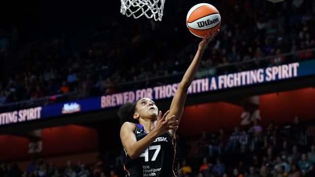 Connecticut Sun guard Leila Lacan (scores on a lay-up.