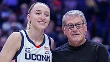 Jan 22, 2025; Storrs, Connecticut, USA; UConn Huskies guard Paige Bueckers (5) is recognized with head coach Geno Auriemma for her 2000 career points before the start of the game against the Villanova Wildcats at Harry A. Gampel Pavilion. Mandatory Credit: David Butler II-Imagn Images