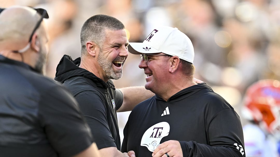 Texas A&M Aggies head coach Mike Elko, right, greet prior to the game at Kyle Field. Texas A&M Aggies head coach Mike Elko, right, greet prior to the game at Kyle Field.