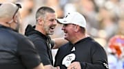 Texas A&M Aggies head coach Mike Elko, right, greet prior to the game at Kyle Field. 