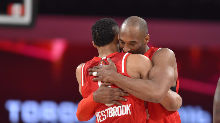 Feb 14, 2016; Toronto, Ontario, CAN; Western Conference forward Kobe Bryant of the Los Angeles Lakers (24) hugs All Star game MVP guard Russell Westbrook of the Oklahoma City Thunder (0) as he leaves the court for his last NBA All Star Game at Air Canada Centre. Mandatory Credit: Bob Donnan-USA TODAY Sports