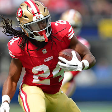 Sep 22, 2024; Inglewood, California, USA; San Francisco 49ers running back Jordan Mason (24) runs the ball against the Los Angeles Rams during the first half at SoFi Stadium.