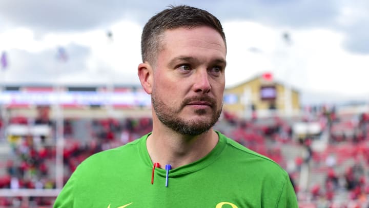 Oct 28, 2023; Salt Lake City, Utah, USA; Oregon Ducks head coach Dan Lanning congratulates players after defeating the Utah Utes at Rice-Eccles Stadium.