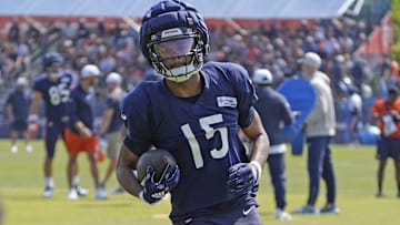 Rome Odunze hauls in a catch during drill work in Bears training camp. He's planning to test his injured knee Sunday in pregame.