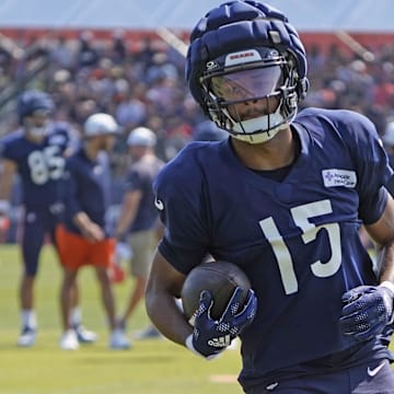 Rome Odunze hauls in a catch during drill work in Bears training camp. He's planning to test his injured knee Sunday in pregame.