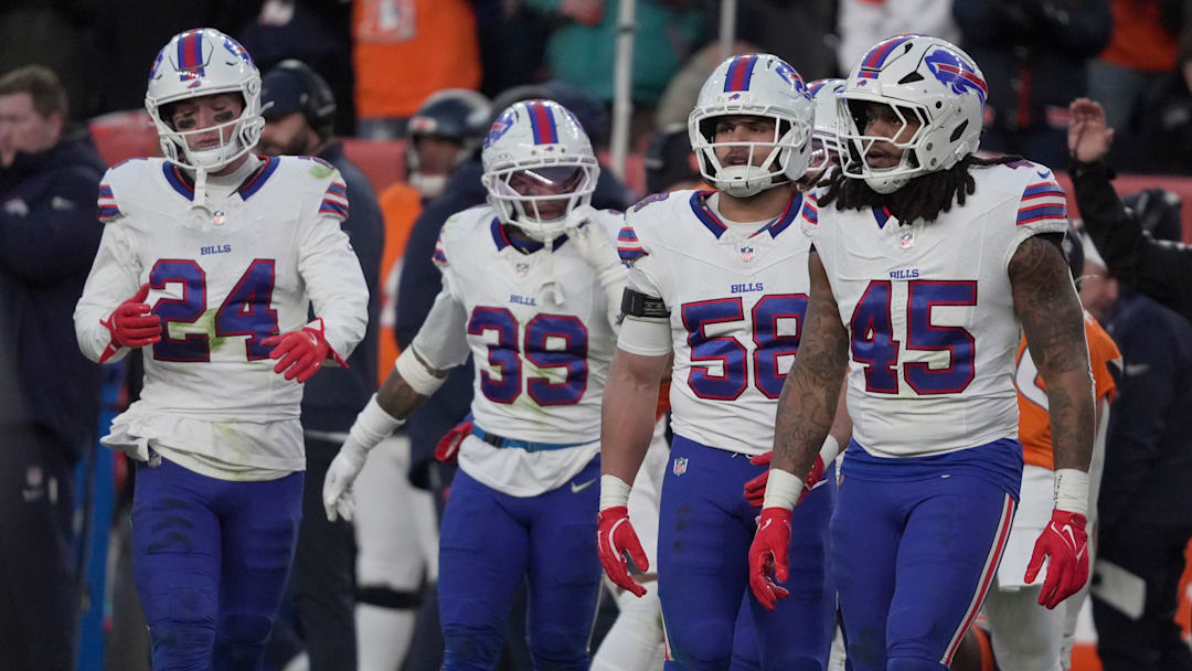 Buffalo Bills safety Cole Bishop, cornerback Cam Lewis, linebacker Matt Milano, and linebacker Shaq Thompson head to the line of scrimmage during second-half action at Empower Field at Mile High in Denver, Colorado on Jan. 17, 2026.