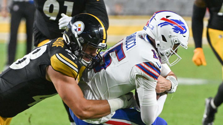 Aug 17, 2024; Pittsburgh, Pennsylvania, USA;  Pittsburgh Steelers linebacker Julius Welschof (48) sacks Buffalo Bills quarterback Ben DiNucci (15) during the fourth quarter at Acrisure Stadium. Mandatory Credit: Barry Reeger-USA TODAY Sports