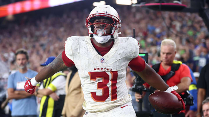 Sep 25, 2025; Glendale, Arizona, USA;  Arizona Cardinals running back Emari Demercado (31) celebrates scoring a touchdown against the Seattle Seahawks in the fourth quarter at State Farm Stadium. Mandatory Credit: Mark J. Rebilas-Imagn Images