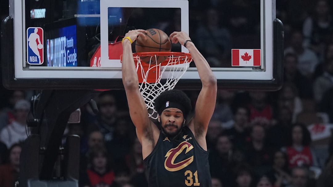 May 1, 2026; Toronto, Ontario, CAN; Cleveland Cavaliers center Jarrett Allen (31) scores a basket over Toronto Raptors center Jakob Poeltl (19) during the first quarter in game six of the first round of the 2026 NBA Playoffs at Scotiabank Arena. Mandatory Credit: Nick Turchiaro-Imagn Images