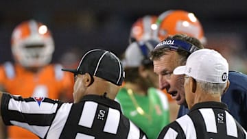 Sep 7, 2024; Champaign, Illinois, USA; Illinois Fighting Illini head coach Bret Bielema talks with officials during the second half against the Kansas Jayhawks at Memorial Stadium. Mandatory Credit: Ron Johnson-Imagn Images