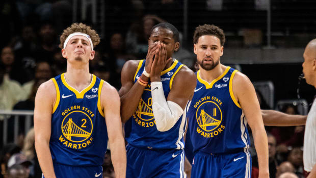 Golden State Warriors guard Brandin Podziemski and forward Jonathan Kuminga