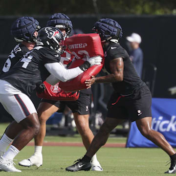 Jul 24, 2025; Houston, TX, USA; Houston Texans tight end Dalton Schultz (86) and tackle Cam Robinson (74) and tight end Brevin Jordan (9) during training camp at Houston Methodist Training Center. Mandatory Credit: Troy Taormina-Imagn Images