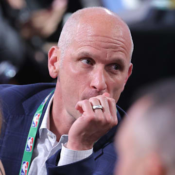Jun 25, 2025; Brooklyn, NY, USA;  Connecticut Huskies mens basketball head coach Dan Hurley looks on at the table of Liam McNeeley in the first round of the 2025 NBA Draft at Barclays Center. Mandatory Credit: Brad Penner-Imagn Images