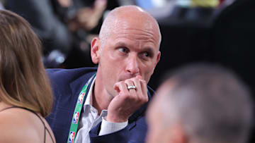 Jun 25, 2025; Brooklyn, NY, USA;  Connecticut Huskies mens basketball head coach Dan Hurley looks on at the table of Liam McNeeley in the first round of the 2025 NBA Draft at Barclays Center. Mandatory Credit: Brad Penner-Imagn Images