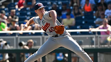Jun 20, 2022; Omaha, NE, USA;  Auburn Tigers pitcher Blake Burkhalter (40) pitches against the Stanford Cardinal in the ninth inning at Charles Schwab Field. Mandatory Credit: Steven Branscombe-Imagn Images
