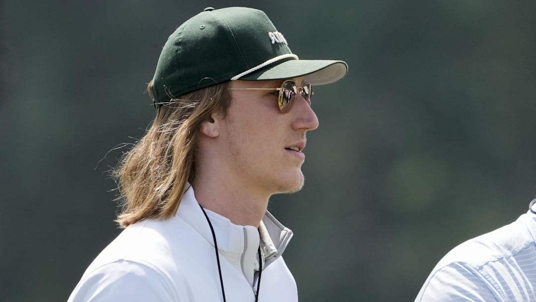 Apr 12, 2025; Augusta, Georgia, USA; Jacksonville Jaguars quarterback Trevor Lawrence walks past no. 10 during the third round of the Masters Tournament at Augusta National Golf Club. Mandatory Credit: Kyle Terada-Imagn Images