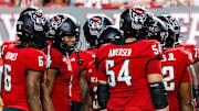 Sep 27, 2025; Raleigh, North Carolina, USA;  North Carolina State Wolfpack huddle during the first half of the game against Virginia Tech Hokies at Carter-Finley Stadium. Mandatory Credit: Jaylynn Nash-Imagn Images