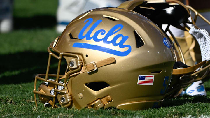 Nov 30, 2024; Pasadena, California, USA; UCLA Bruins helmets during pregame warmups before playing the Fresno State Bulldogs at Rose Bowl. Mandatory Credit: Robert Hanashiro-Imagn Images Nov 30, 2024; Pasadena, California, USA; UCLA Bruins helmets during pregame warmups before playing the Fresno State Bulldogs at Rose Bowl. Mandatory Credit: Robert Hanashiro-Imagn Images