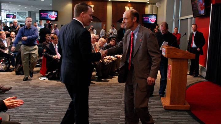 Dec 5, 2014; Lincoln, NE, USA; Nebraska Cornhuskers head coach Mike Riley (right) shakes hands with athletic director Shawn Eichorst at Memorial Stadium. Mandatory Credit: Bruce Thorson-USA TODAY Sports