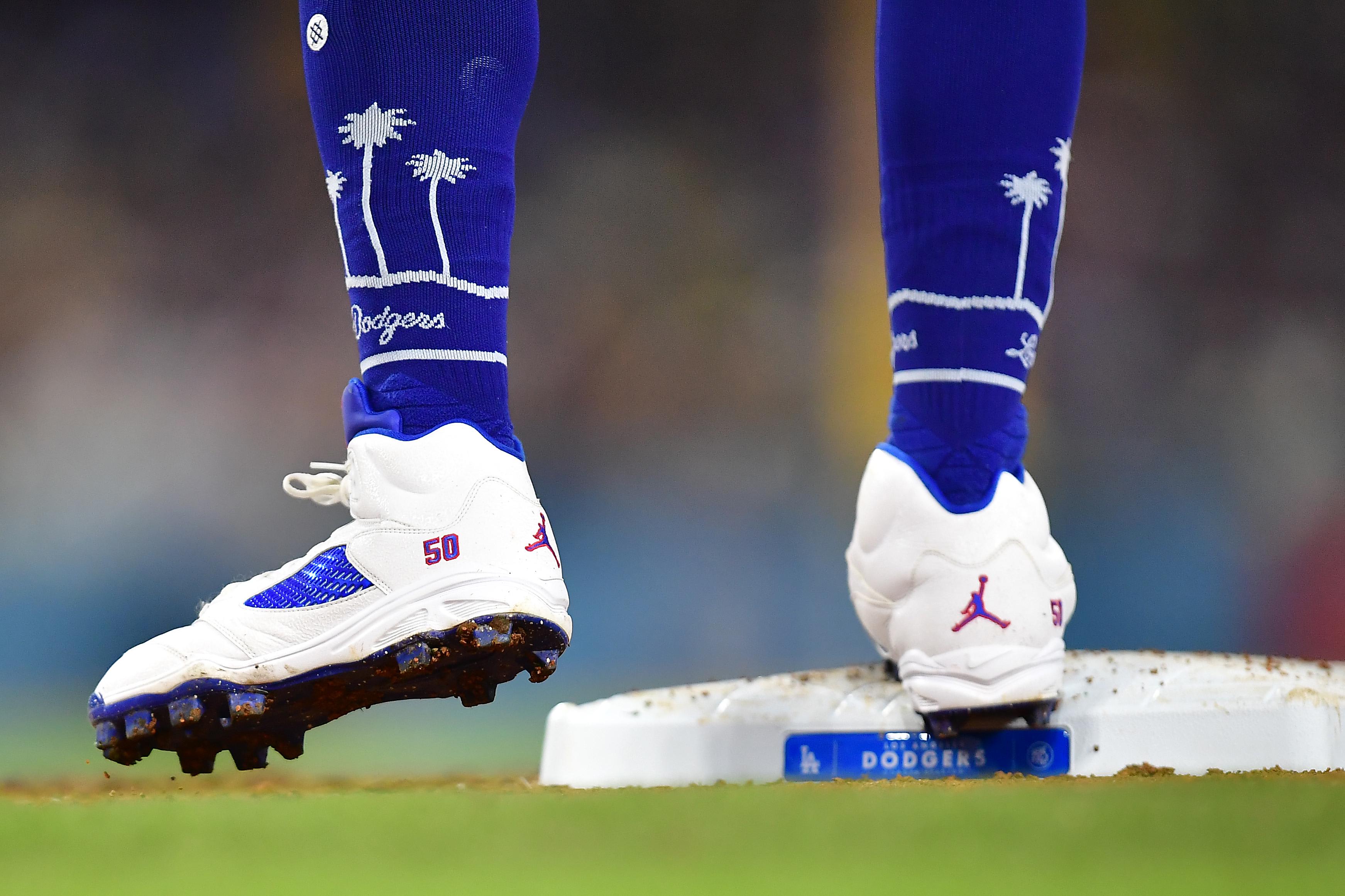 Los Angeles Dodgers infielder Mookie Betts' white and blue Air Jordan cleats.