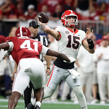 Dec 2, 2023; Atlanta, GA, USA; Georgia Bulldogs quarterback Carson Beck (15) throws a pass in the second quarter against the Alabama Crimson Tide at Mercedes-Benz Stadium. Mandatory Credit: Brett Davis-Imagn Images