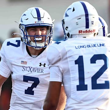 St. Xavier quarterback Chase Herbstreit reacts after scoring a touchdown.