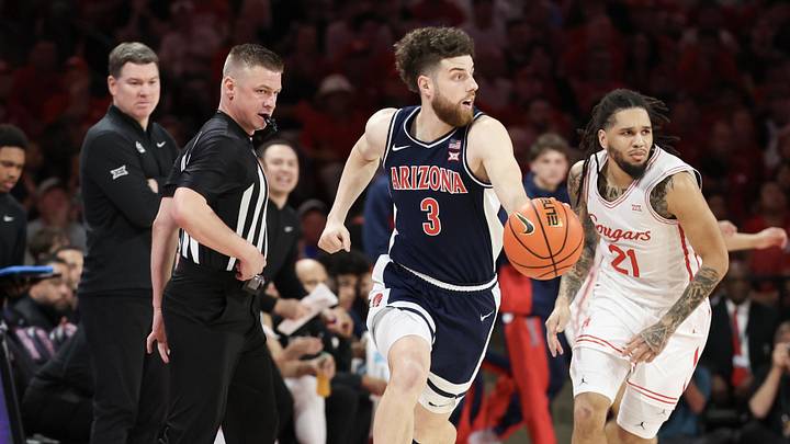 Feb 21, 2026; Houston, Texas, USA; Arizona Wildcats guard Anthony Dell'orso (3) dribbles against Houston Cougars guard Emanuel Sharp (21)  in the first half at Fertitta Center. Mandatory Credit: Thomas Shea-Imagn Images