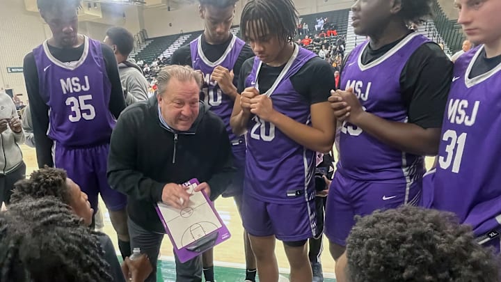 Mount St. Joseph coach Pat Clatchey gives instructions during Friday’s Baltimore Catholic League Tournament quarterfinals. After an up-and-down regular season, the Gaels upset Archbishop Spalding, 66-65, to advance to Sunday’s semifinals at Loyola University.