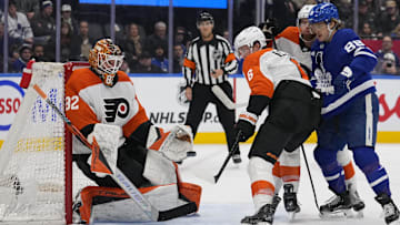 Jan 5, 2025; Toronto, Ontario, CAN; Philadelphia Flyers goaltender Ivan Fedotov (82) goes to make a glove save as defenceman Travis Sanheim (6) and Toronto Maple Leafs forward William Nylander (88) look on during the third period at Scotiabank Arena.