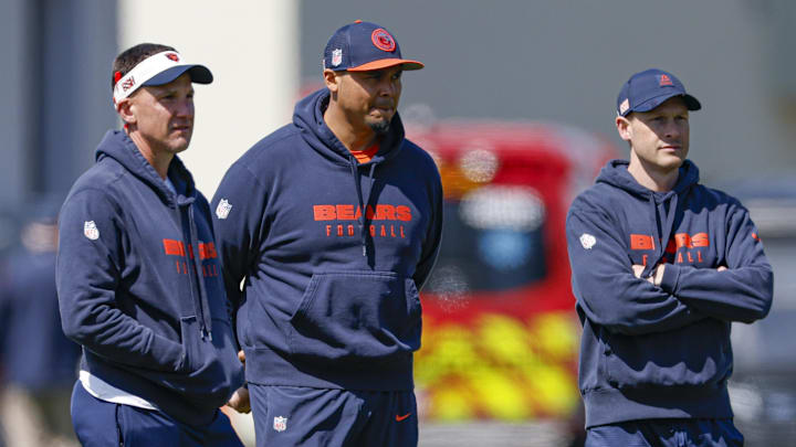 May 9, 2025; Lake Forest, IL, USA; Chicago Bears defensive coordinator Dennis Allen (L), general manager Ryan Poles (C) and head coach Ben Johnson (R) observe during the Rookie Minicamp at Halas Hall. Mandatory Credit: Kamil Krzaczynski-Imagn Images