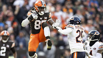 Dec 17, 2023; Cleveland, Ohio, USA; Cleveland Browns tight end David Njoku (85) leaps to avoid a