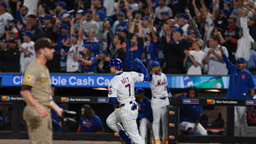 Sep 16, 2025; New York City, New York, USA; New York Mets third baseman Brett Baty (7) hits a two run home run during the first inning against the San Diego Padres at Citi Field. Mandatory Credit: Vincent Carchietta-Imagn Images
