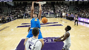 UCLA Bruins center Aday Mara (15) dunks the ball on a Northwestern Wildcats center.