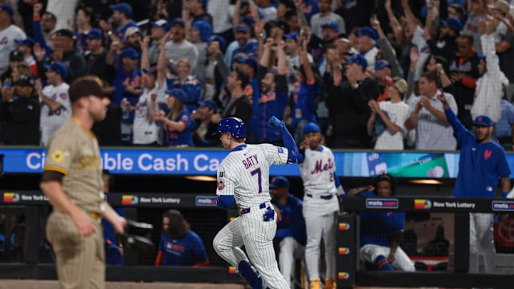 Sep 16, 2025; New York City, New York, USA; New York Mets third baseman Brett Baty (7) hits a two run home run during the first inning against the San Diego Padres at Citi Field. Mandatory Credit: Vincent Carchietta-Imagn Images
