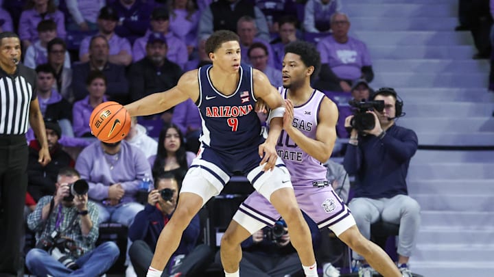 Feb 11, 2025; Manhattan, Kansas, USA; Arizona Wildcats forward Carter Bryant (9) is guarded by Kansas State Wildcats guard David Castillo (10) during the first half at Bramlage Coliseum. Mandatory Credit: Scott Sewell-Imagn Images