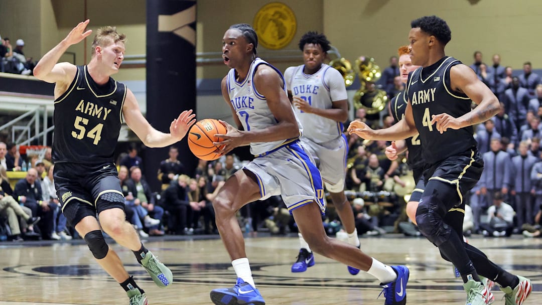 Nov 11, 2025; West Point, New York, USA; Duke basketball guard/forward Dame Sarr (7) tries to get past Army Black Knights forward Jorn Everson (54) and guard Jaxson Bell (4) during the second half at Christl Arena.