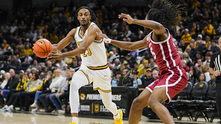 Missouri Tigers guard Aidan Shaw (23) drives to the basket, in a game against the Oklahoma Sooners this season.
