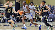 Nov 11, 2025; West Point, New York, USA; Duke Blue Devils guard/forward Dame Sarr (7) tries to get past Army Black Knights forward Jorn Everson (54) and guard Jaxson Bell (4) during the second half at Christl Arena. Mandatory Credit: Danny Wild-Imagn Images