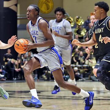 Nov 11, 2025; West Point, New York, USA; Duke Blue Devils guard/forward Dame Sarr (7) tries to get past Army Black Knights forward Jorn Everson (54) and guard Jaxson Bell (4) during the second half at Christl Arena. Mandatory Credit: Danny Wild-Imagn Images