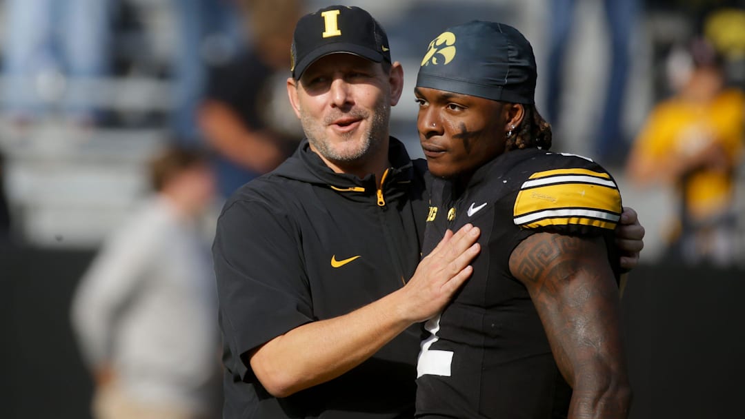Iowa’s offensive coordinator Tim Lester greets running back Kaleb Johnson (2) before the Hawkeyes play Washington Saturday, Oct. 12, 2024 at Kinnick Stadium in Iowa City, Iowa.