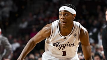 Nov 15, 2024; College Station, Texas, USA; Texas A&M Aggies guard Zhuric Phelps (1) dribbles the ball against the Ohio State Buckeyes during the first half at Reed Arena. Mandatory Credit: Maria Lysaker-Imagn Images 