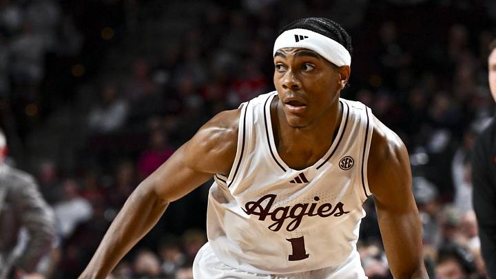 Nov 15, 2024; College Station, Texas, USA; Texas A&M Aggies guard Zhuric Phelps (1) dribbles the ball against the Ohio State Buckeyes during the first half at Reed Arena. Mandatory Credit: Maria Lysaker-Imagn Images 