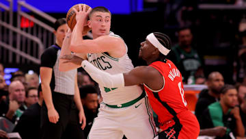 Jan 3, 2025; Houston, Texas, USA; Boston Celtics guard Payton Pritchard (11) controls the ball against Houston Rockets guard Aaron Holiday (0) during the second quarter at Toyota Center. Mandatory Credit: Erik Williams-Imagn Images