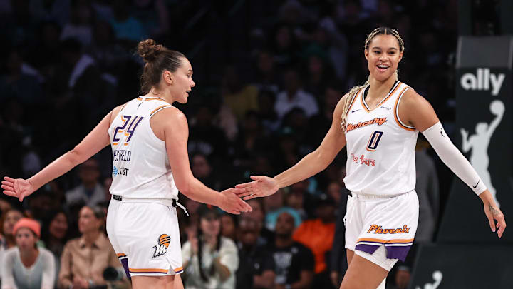 Sep 17, 2025; Brooklyn, New York, USA; Phoenix Mercury forward Kathryn Westbeld (24) and Phoenix Mercury forward Satou Sabally (0) celebrate after the New York Liberty call a timeout during game two of round one for the 2025 WNBA Playoffs at Barclays Center. Mandatory Credit: Wendell Cruz-Imagn Images